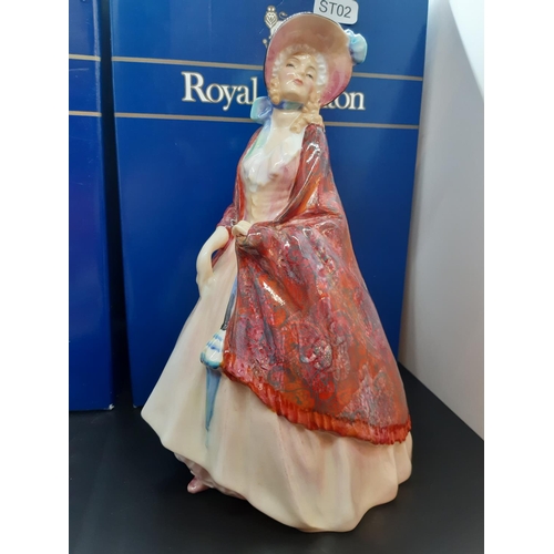 114 - Two boxed Royal Doulton figurines to include 'Christmas Time' and 'Paisley Shawl'