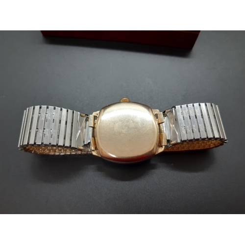 14 - A vintage Rotary mens wristwatch in hallmarked 9ct gold case with sub second dial at six and elastic... 