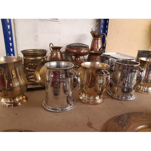 140 - A collection of assorted metalware to include copper and brass bound jug, silver plated tankards, br... 