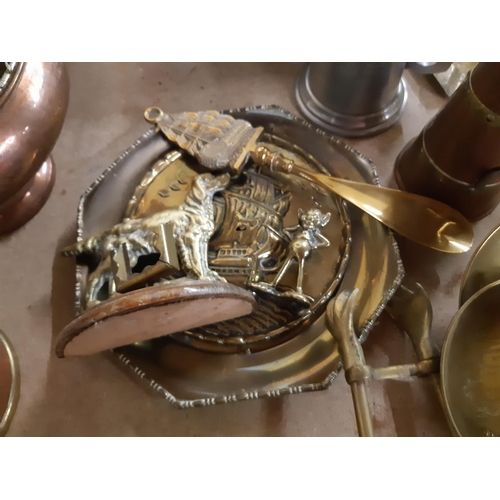 140 - A collection of assorted metalware to include copper and brass bound jug, silver plated tankards, br... 