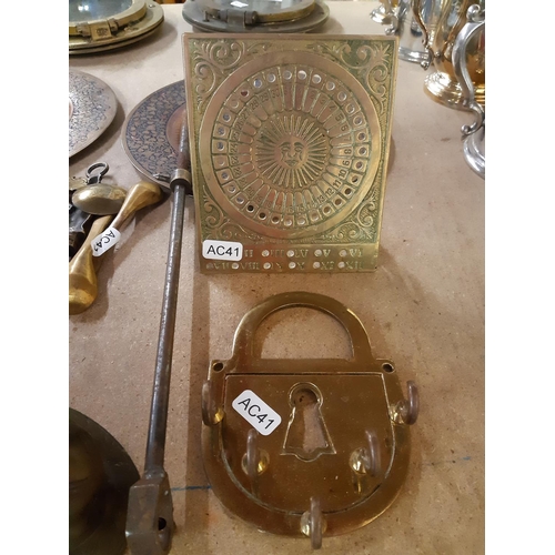 141 - A collection of assorted metalware to include a pair of Middle Eastern brass plates with enamel deco... 