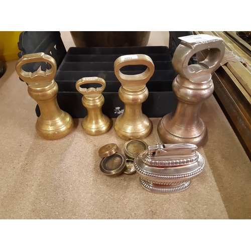 149 - A collection of assorted metalware to include four Victorian brass bell weights, Ronson Queen Anne t... 