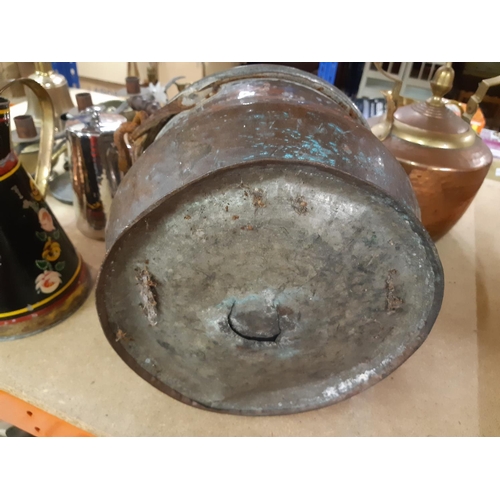 160 - Three pieces of metalware to include a hammered copper bucket, Victorian style copper and brass kett... 