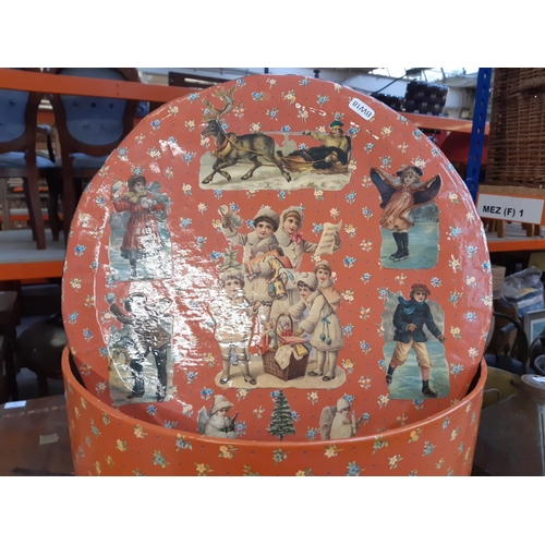 177 - A Victorian style cylindrical decoupage Christmas themed lidded box - measuring approx. 47cm high an... 