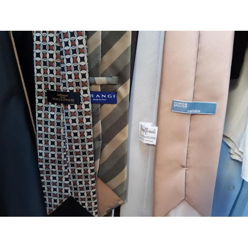 189 - A large quantity of various clothing to include men's suit jackets, as new Farah suit trousers, shir... 