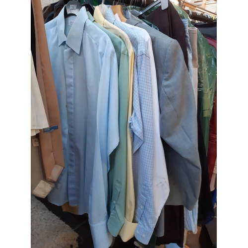 189 - A large quantity of various clothing to include men's suit jackets, as new Farah suit trousers, shir... 