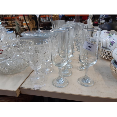 198 - A large collection of assorted glassware to include a boxed set of 4 Royal Doulton champagne flutes,... 