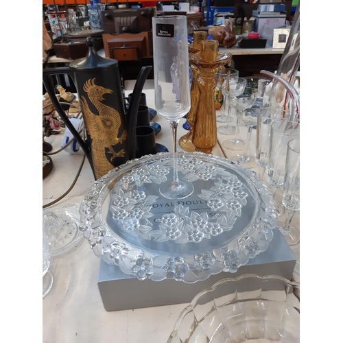 198 - A large collection of assorted glassware to include a boxed set of 4 Royal Doulton champagne flutes,... 