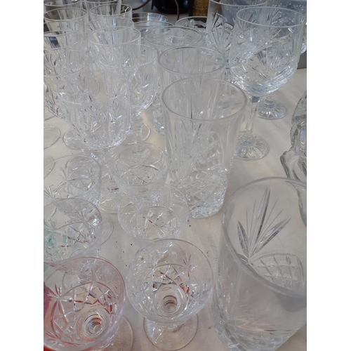 198 - A large collection of assorted glassware to include a boxed set of 4 Royal Doulton champagne flutes,... 