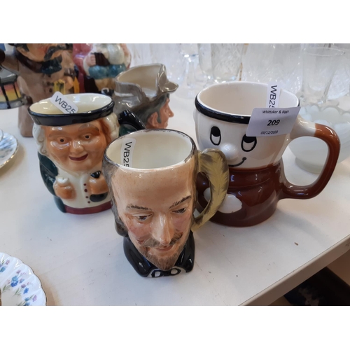 209 - Ten ceramic items to include Staffordshire Toby jugs, Royal Doulton Rip Van Winkle character jug (se... 