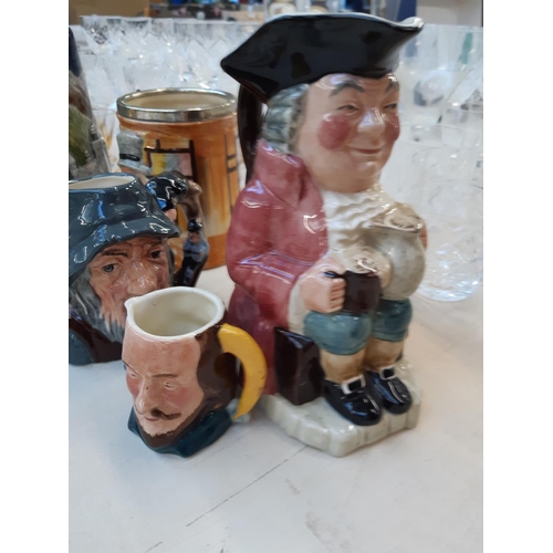 209 - Ten ceramic items to include Staffordshire Toby jugs, Royal Doulton Rip Van Winkle character jug (se... 