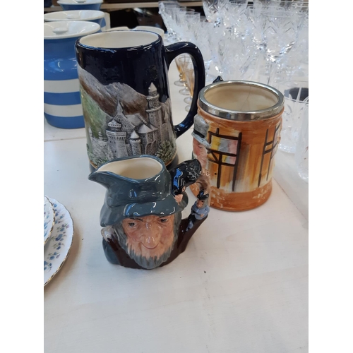 209 - Ten ceramic items to include Staffordshire Toby jugs, Royal Doulton Rip Van Winkle character jug (se... 