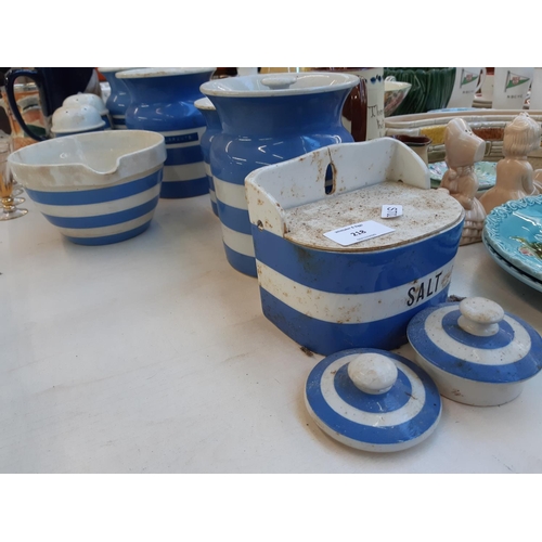 218 - 8 pieces of T.G Green Cornishware to include 4 jars and covers, wall hanging salt box, small mixing ... 