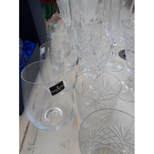 219 - A collection of cut crystal glassware to include 4 Dartington stemless wine glasses, tumblers, sherr... 