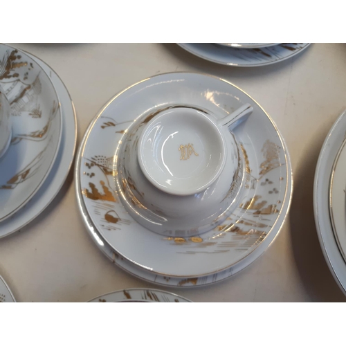 228 - An approx. 40 piece oriental white and gold dinner service