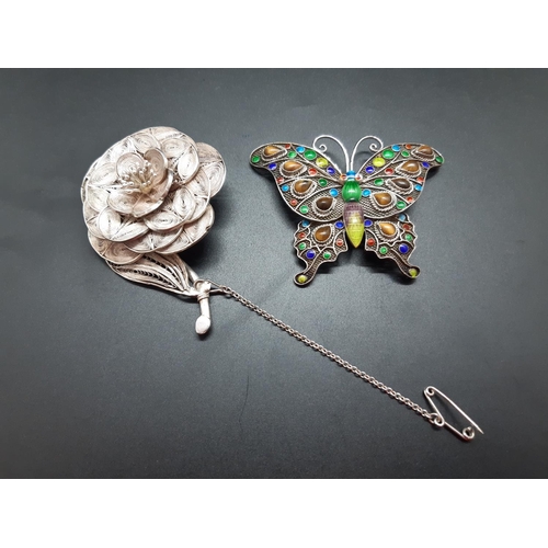 61 - Two vintage silver brooches to include a silver and enamel butterfly brooch and a 900 grade silver f... 