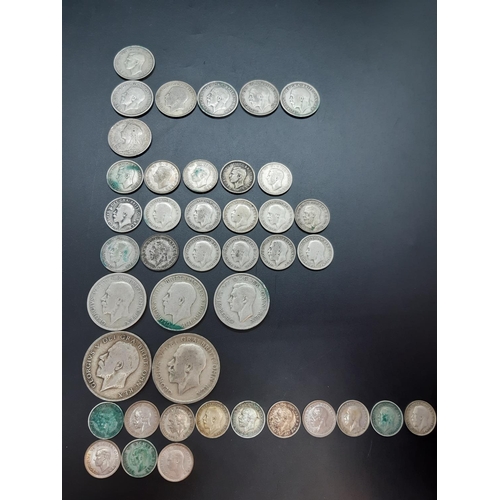 80 - A collection of 50% silver British coins to include 2 half crowns, 3 florins, 7 shillings, 17 sixpen... 