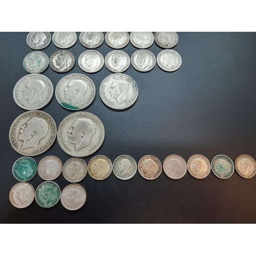 80 - A collection of 50% silver British coins to include 2 half crowns, 3 florins, 7 shillings, 17 sixpen... 