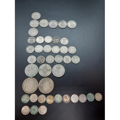 80 - A collection of 50% silver British coins to include 2 half crowns, 3 florins, 7 shillings, 17 sixpen... 