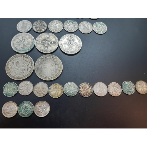 80 - A collection of 50% silver British coins to include 2 half crowns, 3 florins, 7 shillings, 17 sixpen... 