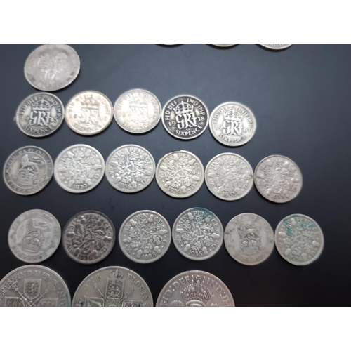 80 - A collection of 50% silver British coins to include 2 half crowns, 3 florins, 7 shillings, 17 sixpen... 