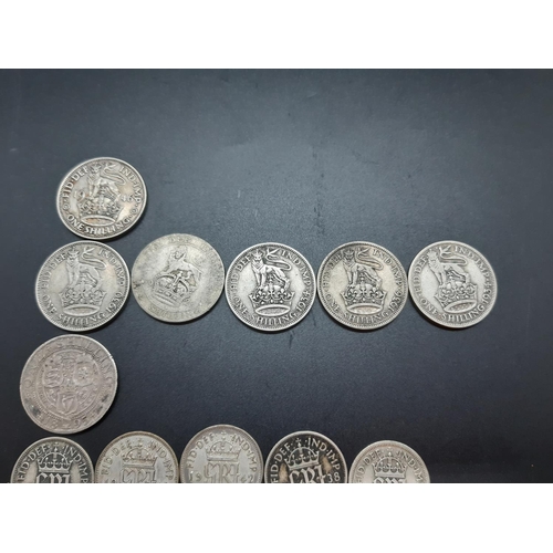 80 - A collection of 50% silver British coins to include 2 half crowns, 3 florins, 7 shillings, 17 sixpen... 