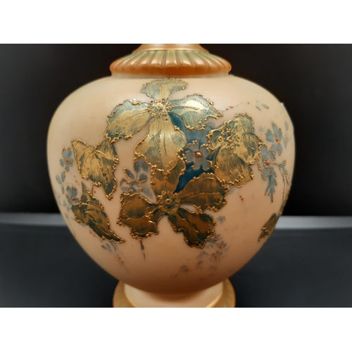 87 - A 1907 Royal Worcester Blush Ivory vase of globular form with high slender neck and hand painted flo... 