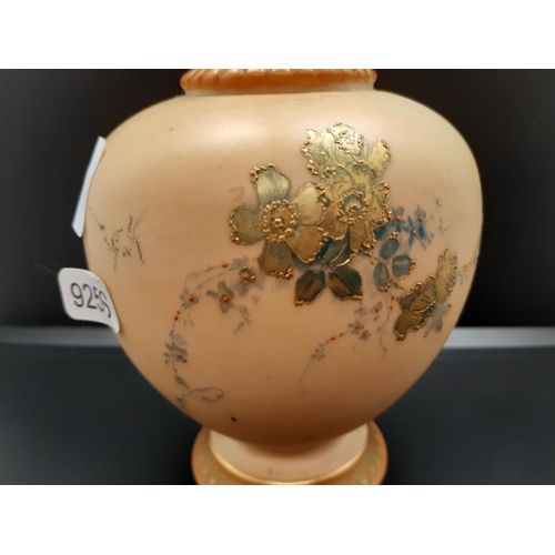 87 - A 1907 Royal Worcester Blush Ivory vase of globular form with high slender neck and hand painted flo... 