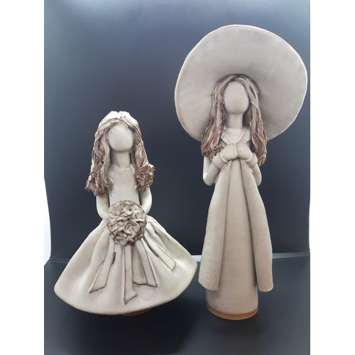 99 - Two Veronica Ballan faceless lady stoneware figurines