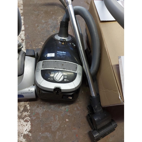 1434 - A black and grey Miele Power Plus 5000 cylinder vacuum cleaner