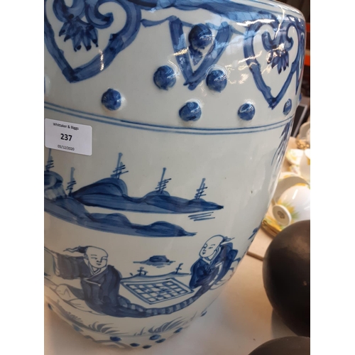 237 - A Chinese hand painted pale blue ceramic barrel garden seat - measuring approx. 44cm high and 34cm i... 