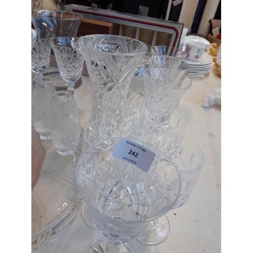 242 - A collection of various ceramics and glassware to include a set of six cut crystal and acid etched w... 