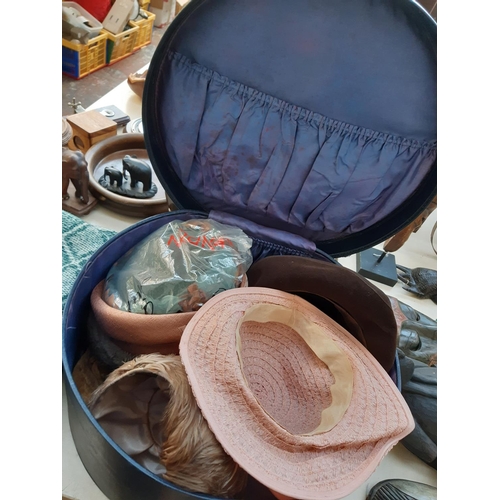 244 - A vintage blue leather hat box containing a large collection of vintage ladies hats to include Escot... 