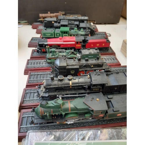 267 - Nine plastic locomotive and tender models, two railway jigsaws, two Thomas the Tank engine prints an... 