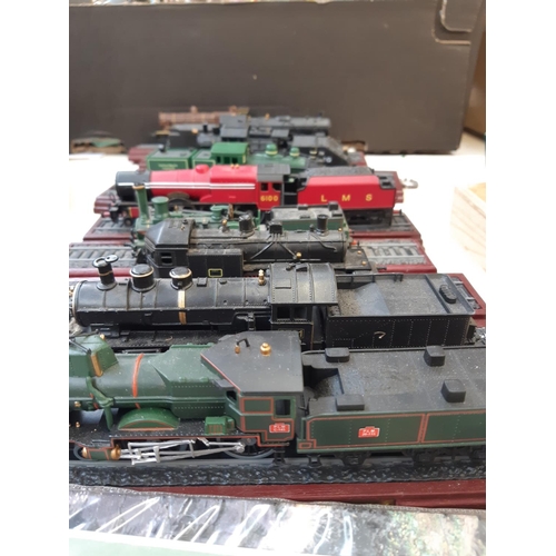 267 - Nine plastic locomotive and tender models, two railway jigsaws, two Thomas the Tank engine prints an... 