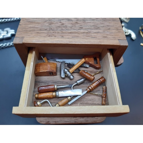 83 - Various collectables to include miniature pen knives, handmade miniature workbench with tools, cuffl... 