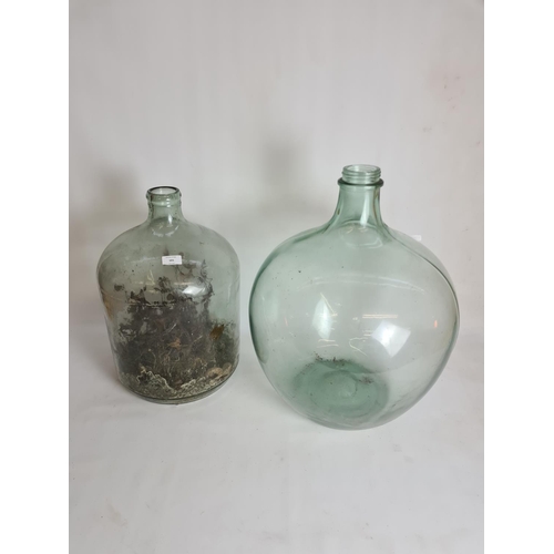 101 - Two vintage glass carboys - approx. 62cm high