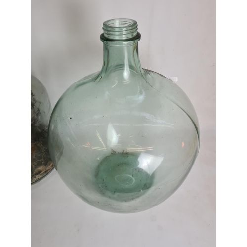 101 - Two vintage glass carboys - approx. 62cm high