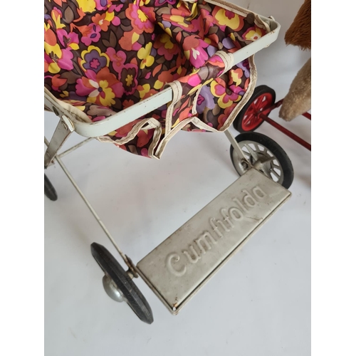 105 - Two items, a vintage push along dog and a vintage Cumfifolda white enamel child's pram