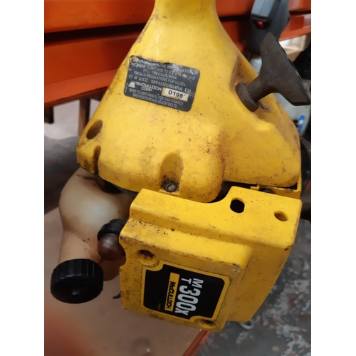 1061 - A yellow McCulloch MT300x petrol strimmer