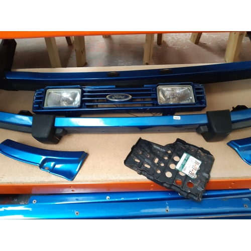 1069 - A rare Ford Escort MKIII two door body kit in metallic blue comprising front and rear bumpers, front... 