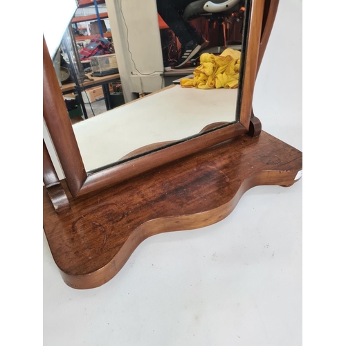 107 - A Victorian mahogany toilet mirror