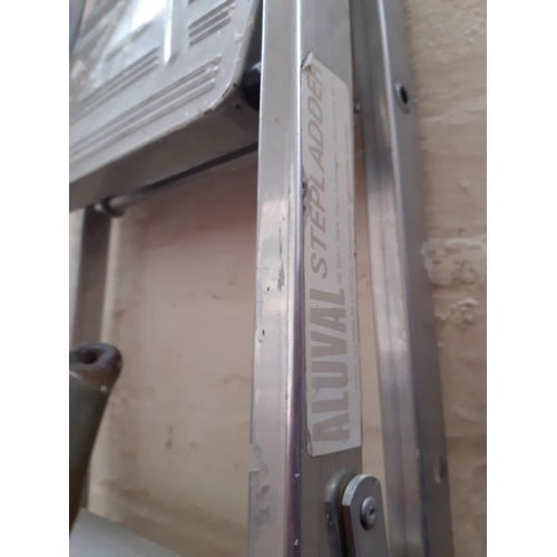 1074 - A mixed lot to include aluminium seven tread step ladders, 4' sash clamp, stainless steel spade and ... 