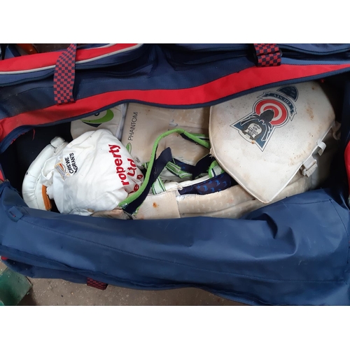 1112 - Three bags of Cricket equipment to include Slazenger stumps and bat, GM helmet and bat, gloves, pads... 