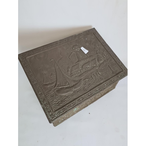 113 - A vintage embossed brass slipper box with nautical design