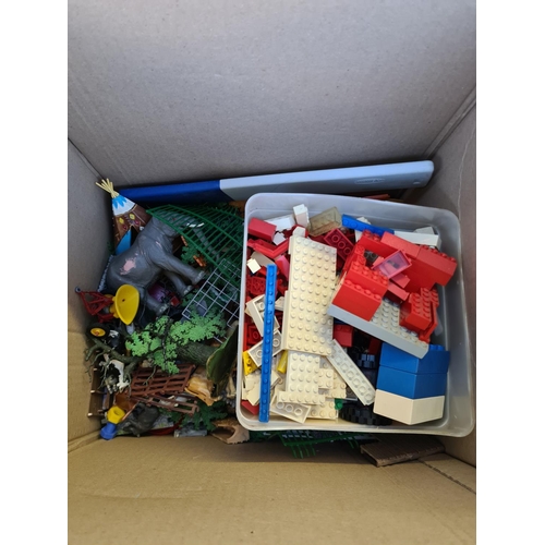 129 - A box containing a large quantity of various toys to include plastic animals, diecast vehicles, Lego... 