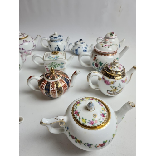 147 - Twelve Franklin Mint Victoria & Albert museum fine porcelain teapots to include Kangxi, Worcester, V... 