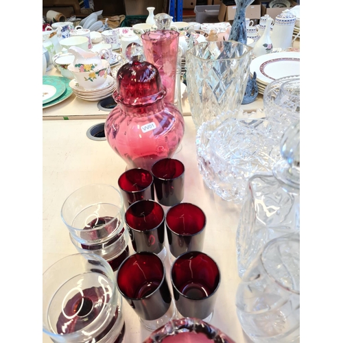 157 - Various glassware to include cranberry glass handled basket, cut glass bowls, cut crystal atomiser, ... 