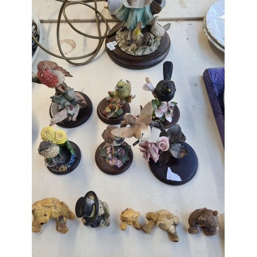 165 - A collection of ceramic bird and bear figurines to include Country Artists, Cherished Teddies etc. t... 