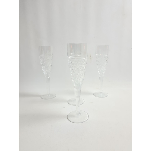 168 - A boxed set of four Royal Doulton Oblique lead crystal champagne flutes